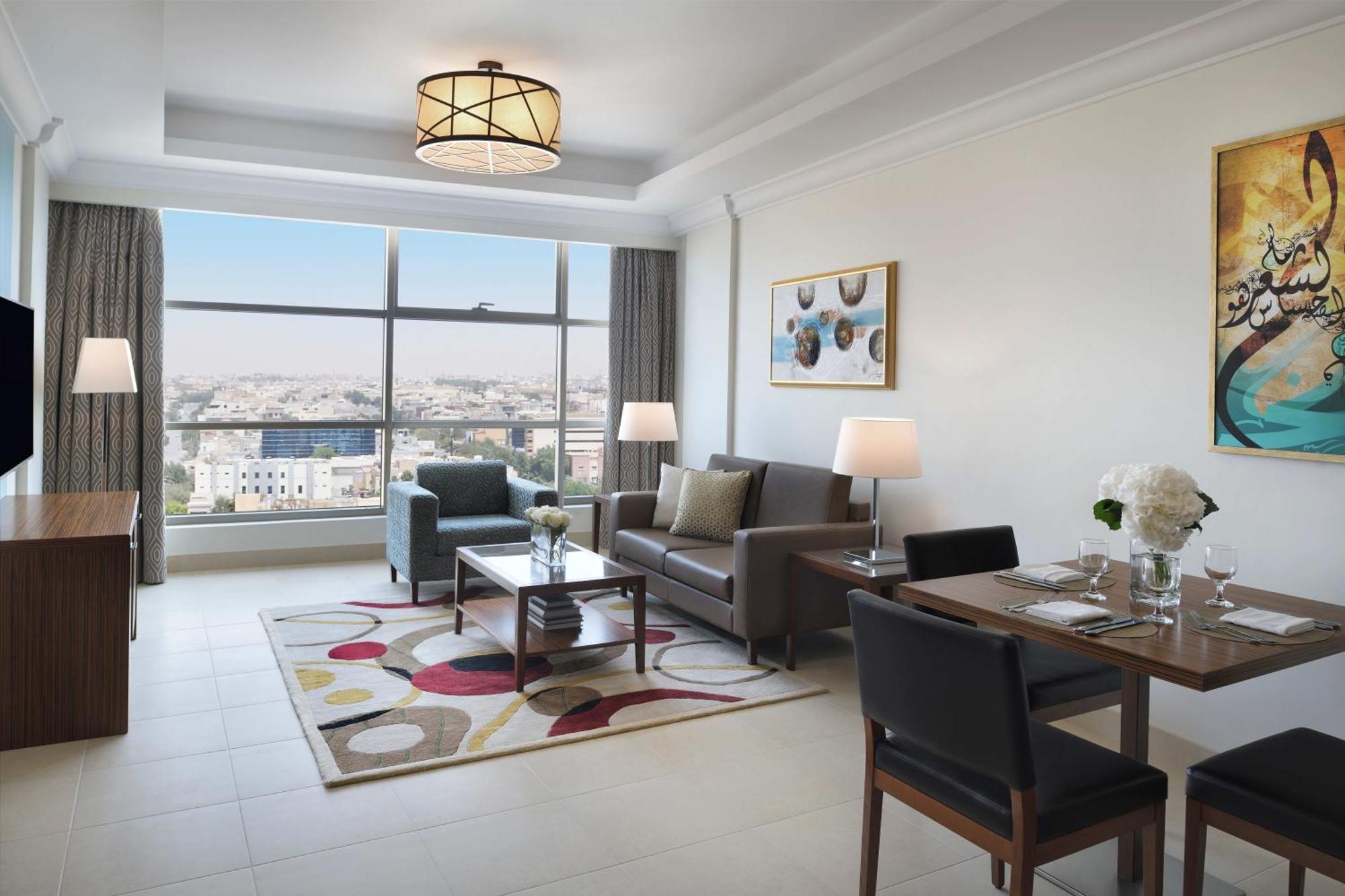 Marriott Executive Apartments Эль-Хубар Экстерьер фото A living room at the hotel